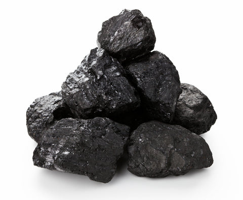 Pile of shiny black lumps of coal on a white background