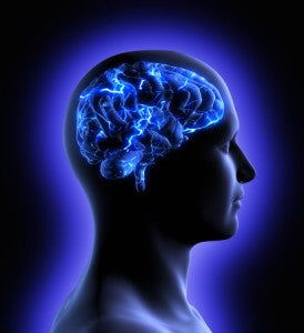 Profile of a human head with a glowing blue brain crackling with electric light