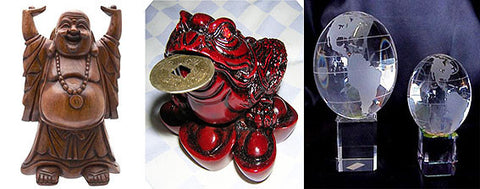 Feng Shui wealth figures: carved wooden laughing Buddha, red money frog holding a coin, and two crystal globes
