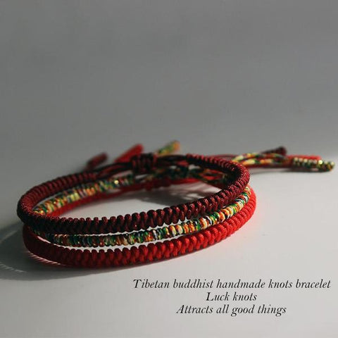 Three Tibetan Buddhist handmade knot bracelets in red and multicolor cord, captioned Luck knots