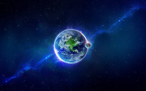 Earth and its moon glowing against a blue starfield