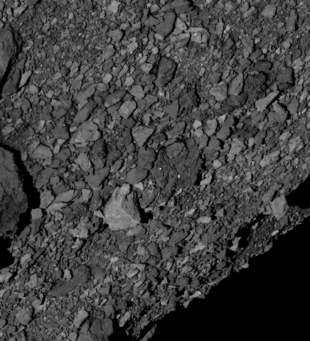 Black-and-white close-up of the boulder-strewn rocky surface of asteroid Bennu