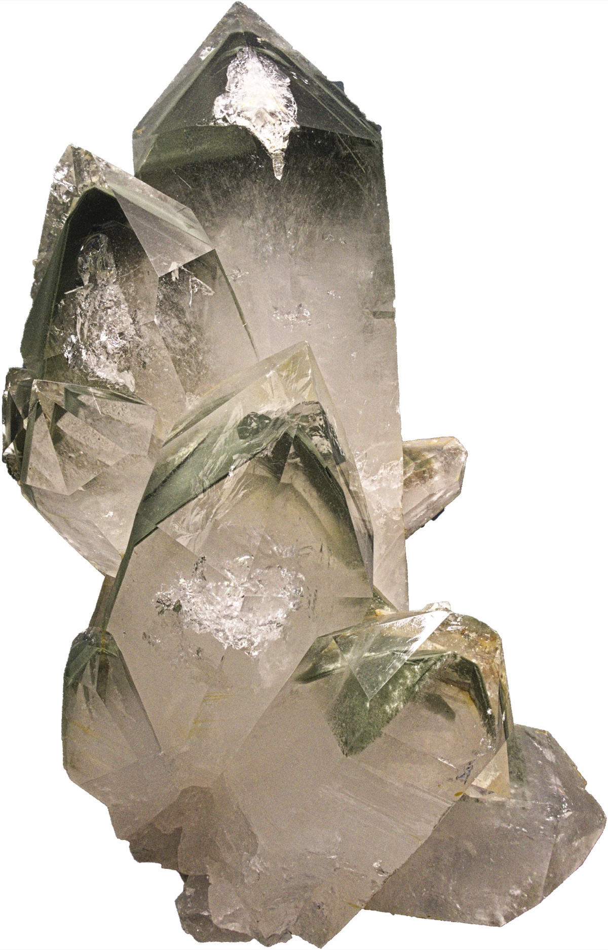 Quartz crystals with thin green chlorite layers tracing smaller crystal outlines inside each point