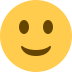 Yellow slightly smiling face emoji