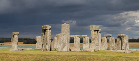 Stonehenge standing stones and lintels under a stormy grey sky