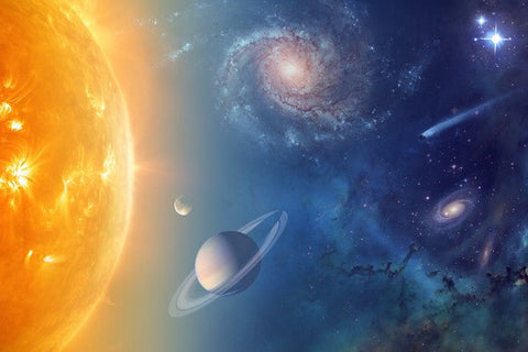 Space illustration of the sun, a ringed planet, a comet and spiral galaxies